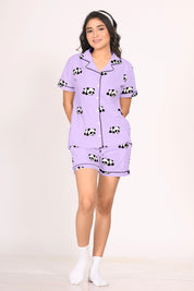 Woman wearing a purple Panda Print Shorts Set, featuring a button-down top with adorable panda designs and matching shorts.