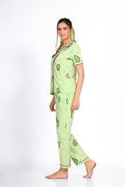 Side view of woman wearing light green colour avocado print night suit/ pyjama set - Napstory