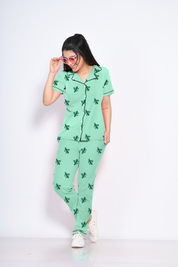 A young lady flaunting green colour cactus print nightwear pyjama set by NapStory