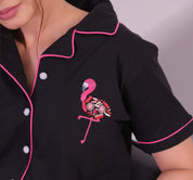 Close look of a a young woman wearing flamingo embroidery premium pyjama set by NapStory