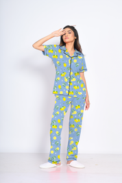 Front View of Napstory Lemon Print Pyjama Set - Woman with Hand on Head