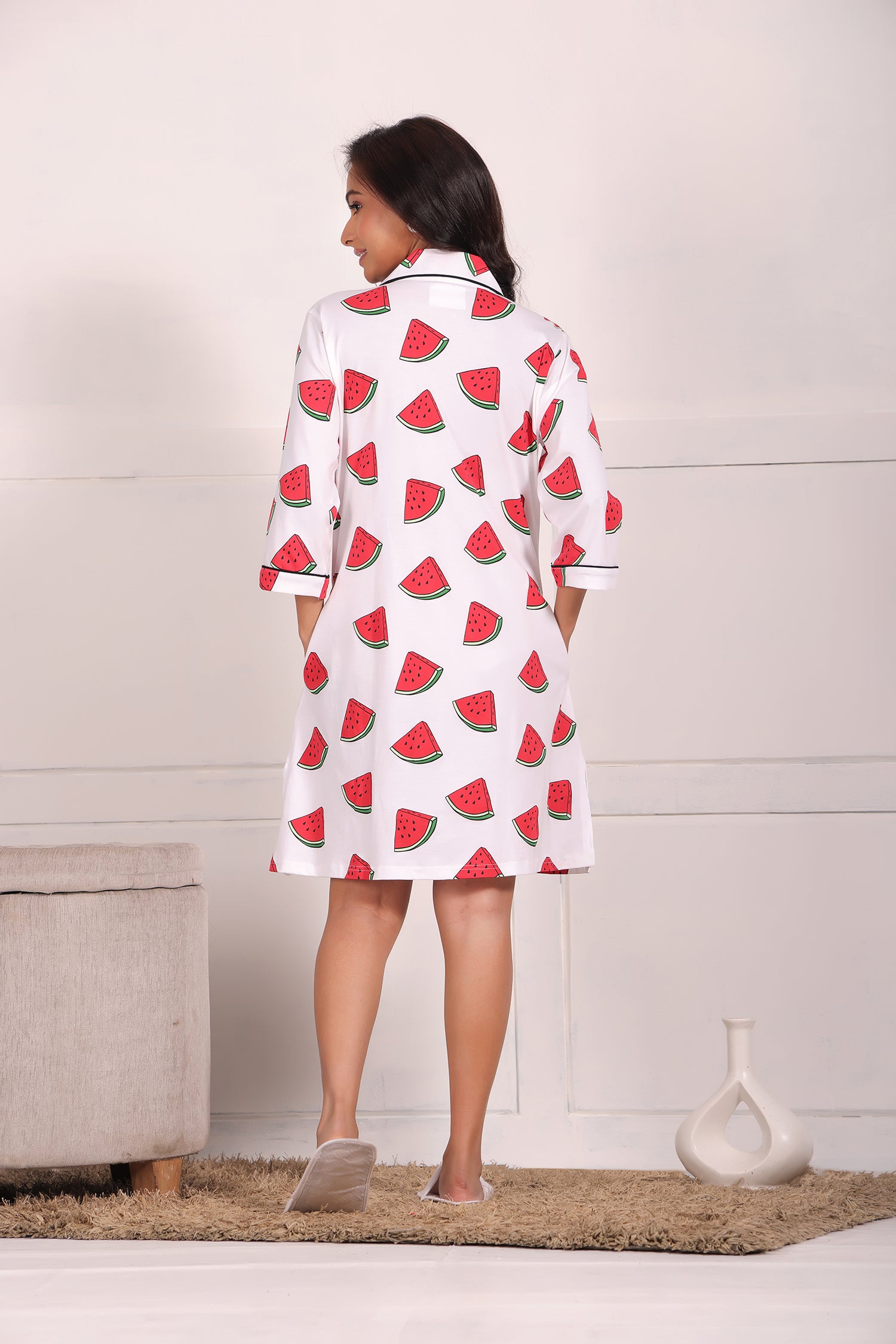 A young girl showcasing back view of watermelon print shorts set nightwear by NapStory