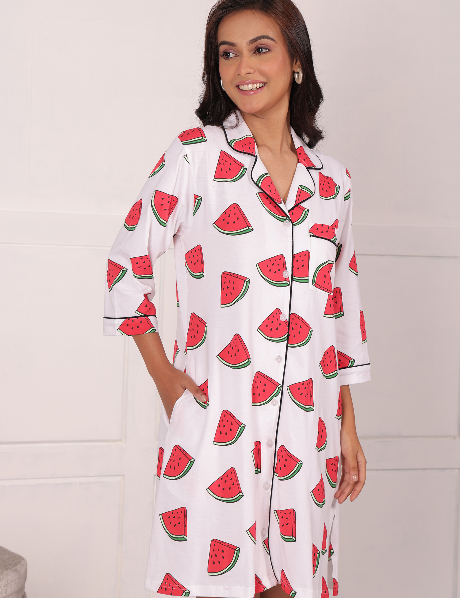 A girl in hands in pocket pose wearing watermelon print shorts set nightwear by NapStory