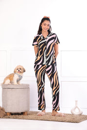 A woman with a dog wearing  Dreamy Waves print nightwear pyjama set for women by NapStory