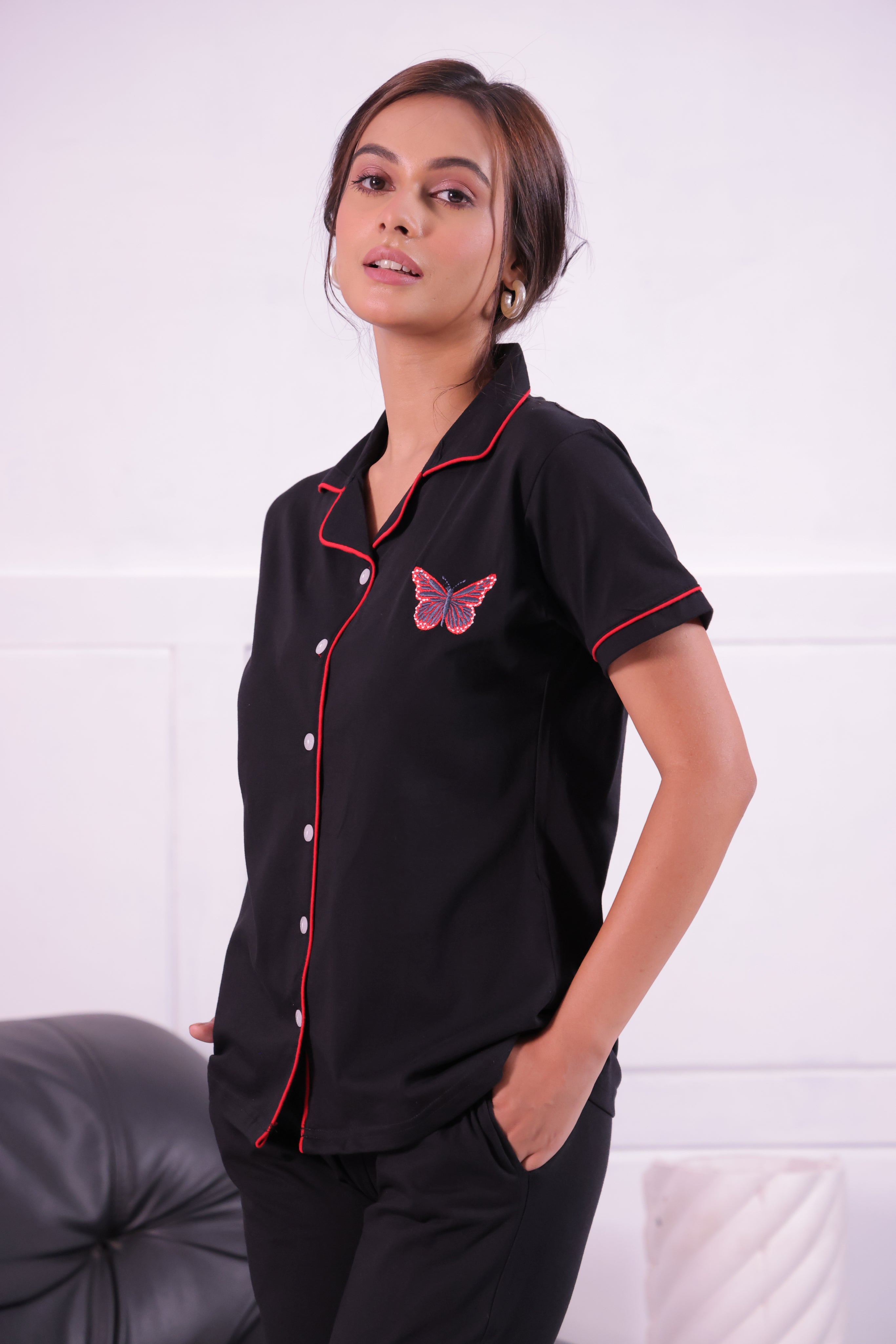 A lady in Butterfly embroidered premium nightwear pyjama set by NapStory