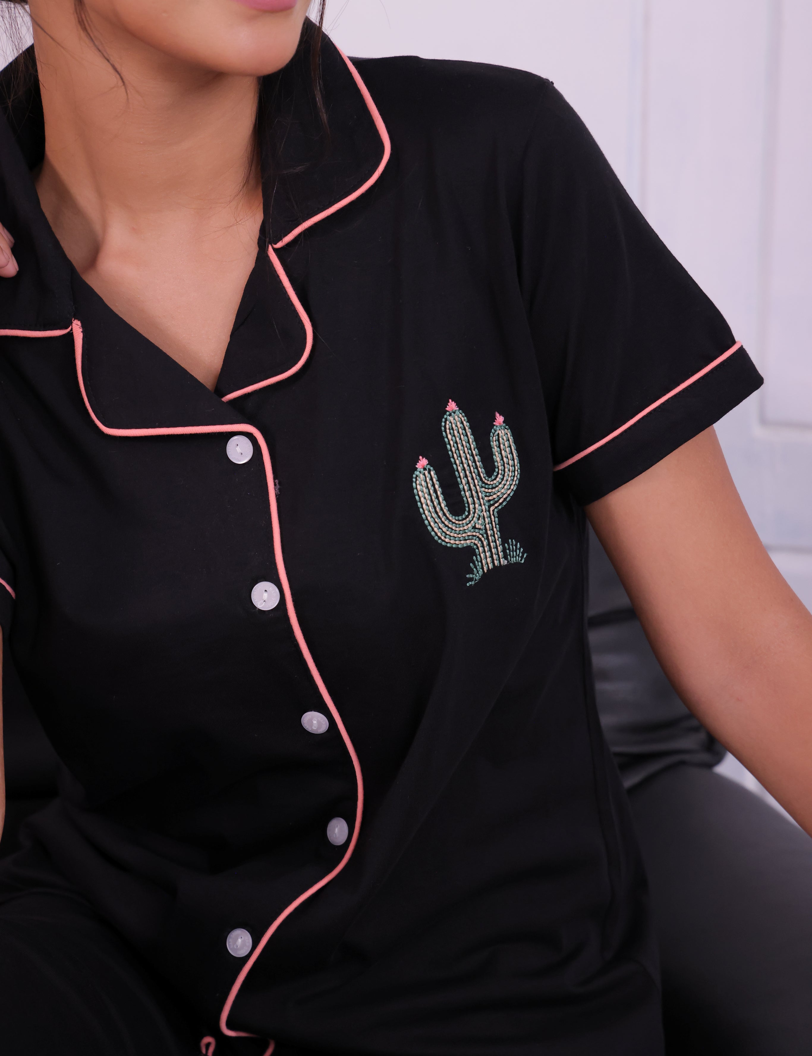 Closer look of a young female in shirt of a Cactus embroidered premium nightwear shirt and pyjama set by NapStory