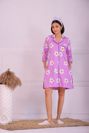 Young girl in a Pink Colour Poppy Print Sleep Shirt nightwear by NapStory, standing gracefully.