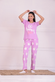 A young lady flaunting animal print nightwear T-shirt and pyjama set by NapStory