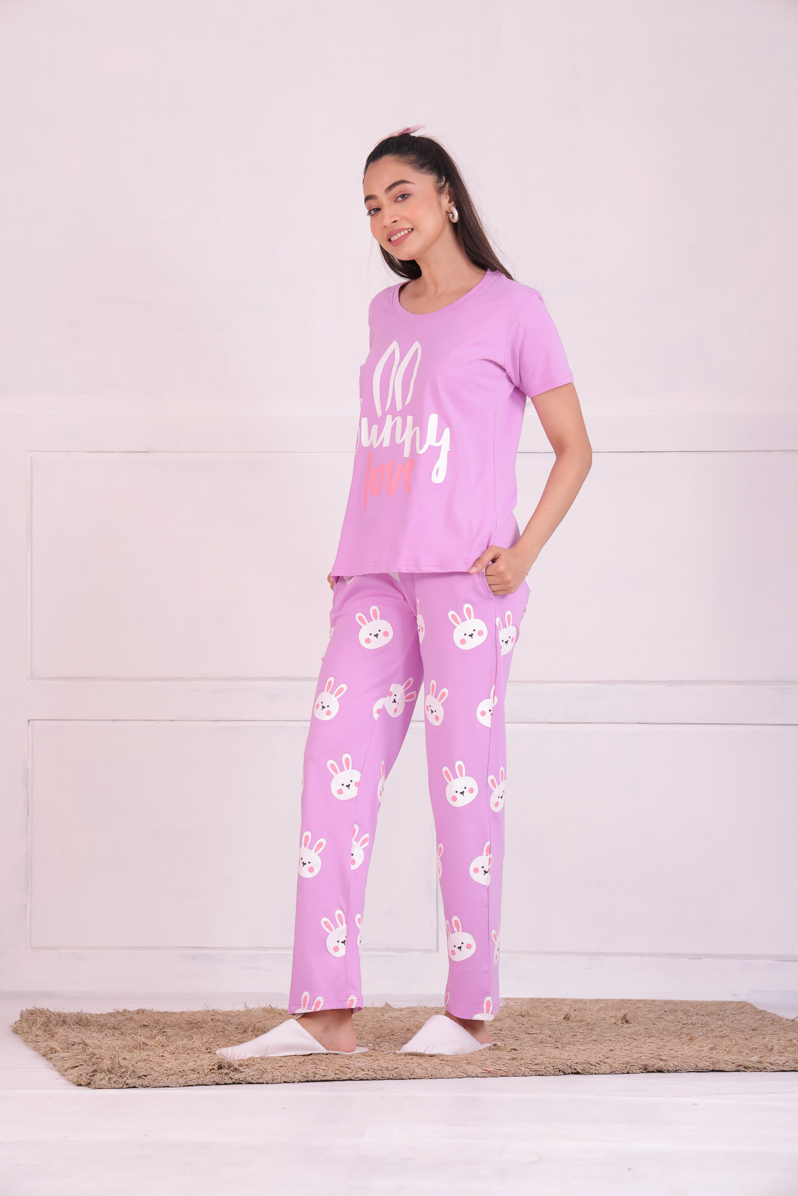 A young lady in animal print nightwear T-shirt and pyjama set by NapStory - Side Pose