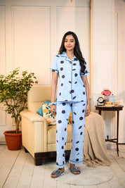 Woman wearing a blue Oreo Print Pyjama Set by NapStory, styled with fun cookie patterns, perfect for nightwear or lounging.