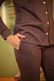 A close-up of the Taupe Brown Full Sleeve Nightsuit Set, highlighting the pocket detail on the pyjama pants, paired with a button-up top.