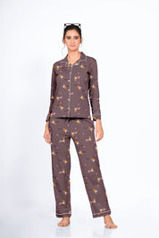 Female in a brown Bunny Cone Print Full Sleeves Pyjama Set by NapStory, standing confidently with a gentle smile.