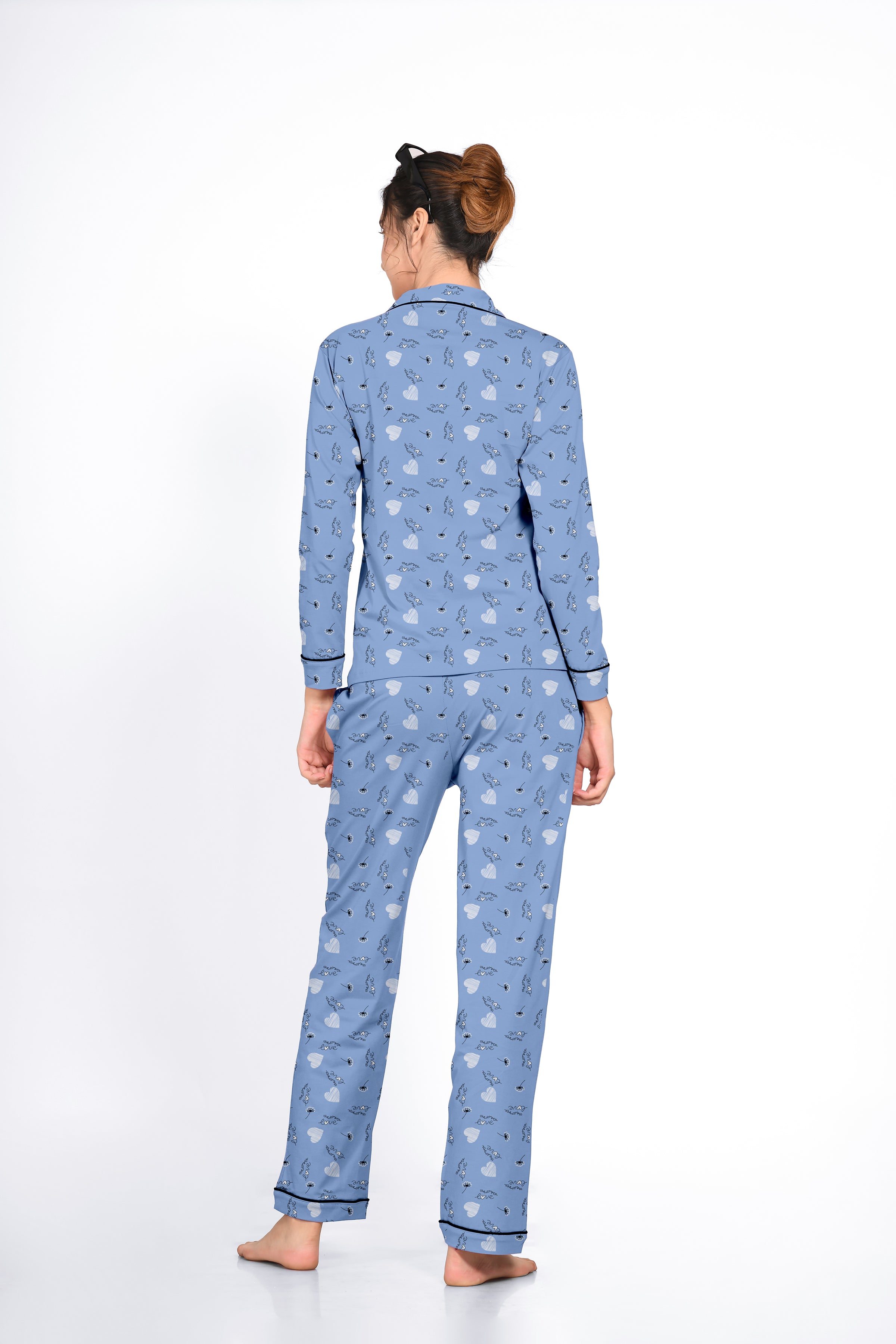 Lady in a blue Dandelion Print Full Sleeves Pyjama Set by NapStory, showing a relaxed back view.