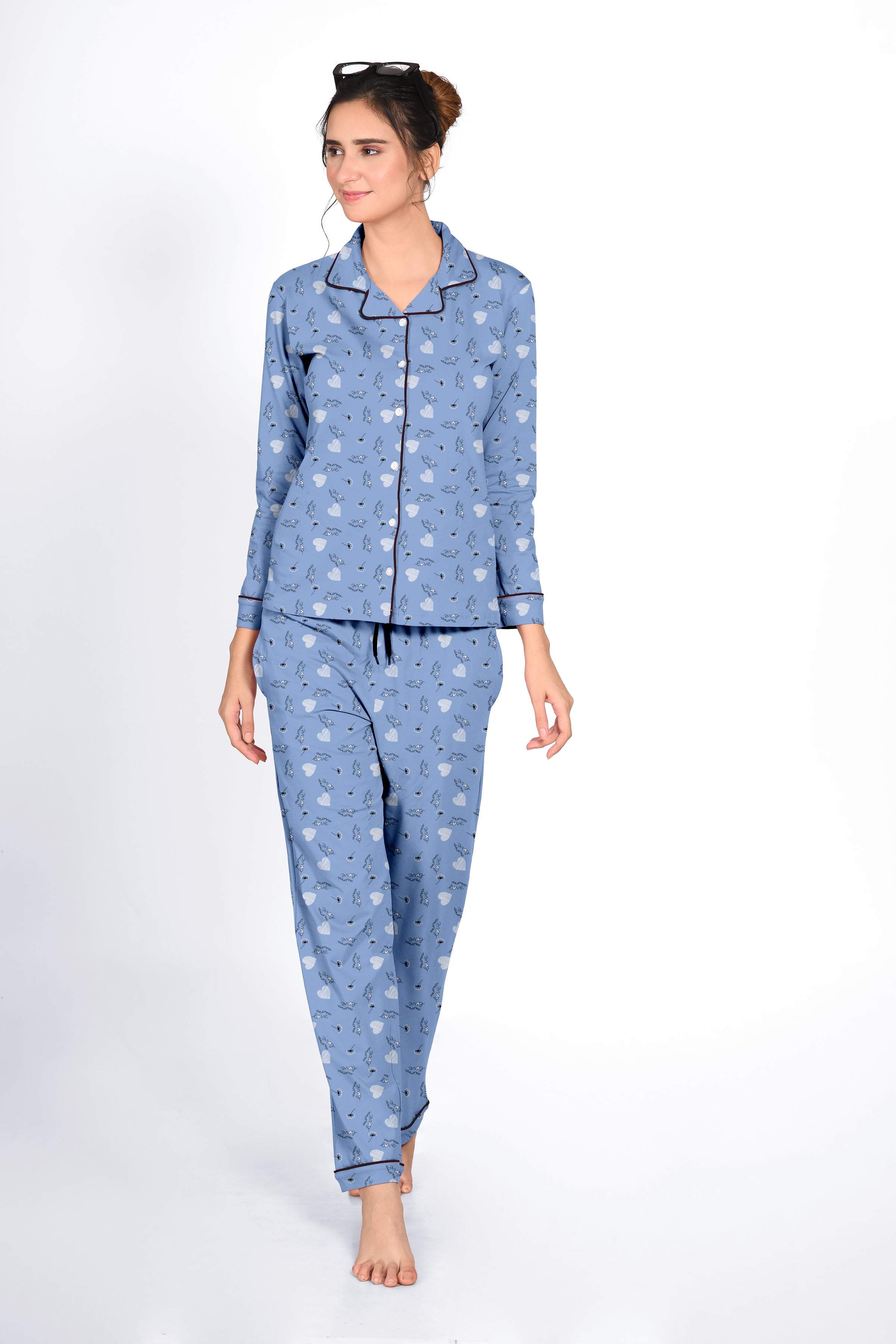 Female in a blue Dandelion Print Full Sleeves Pyjama Set by NapStory, walking with a relaxed and confident expression.