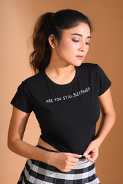 A lady in black baby tee by Napstory