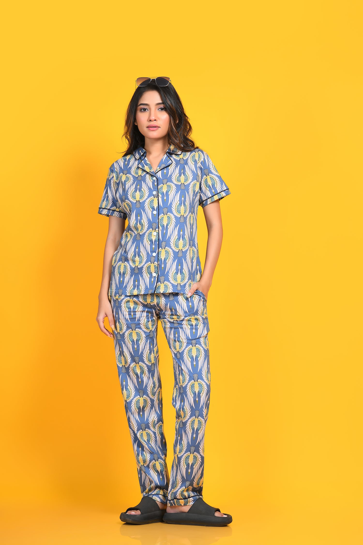 A woman in stylish and trendy bird print night suit/ pyjama and shirt set