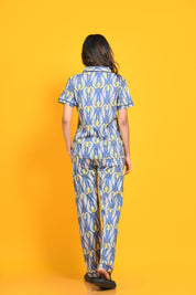 Back view of a woman in stylish and trendy bird print night suit/ pyjama and shirt set