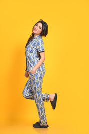 Side view of a woman in stylish and trendy bird print night suit/ pyjama and shirt set