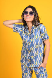 A woman flaunting her stylish and trendy bird print night suit/ pyjama and shirt set