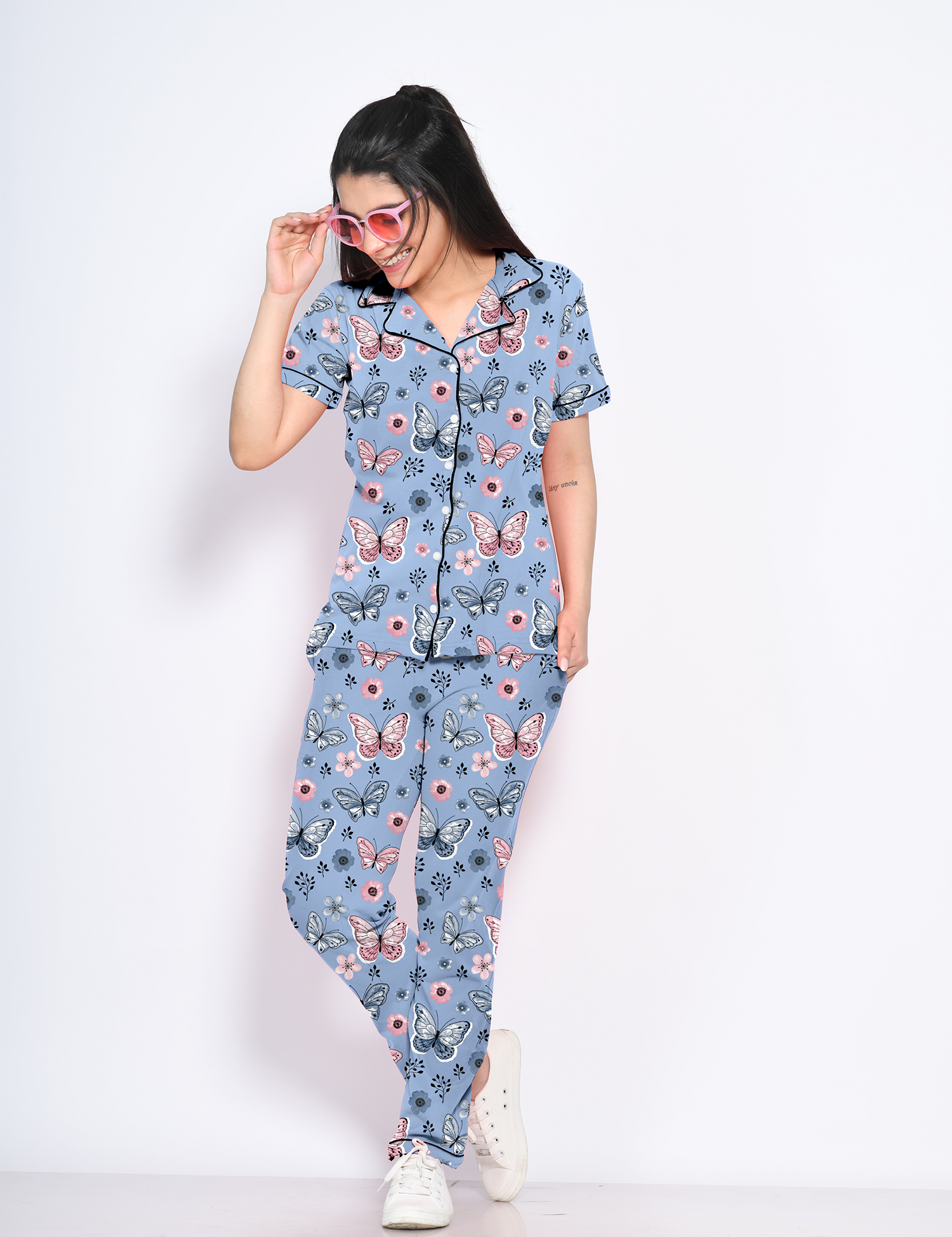 A young female flaunting Butterfly print nightwear pyjama set by NapStory