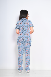 A lady showing back view of Butterfly print nightwear pyjama set by NapStory