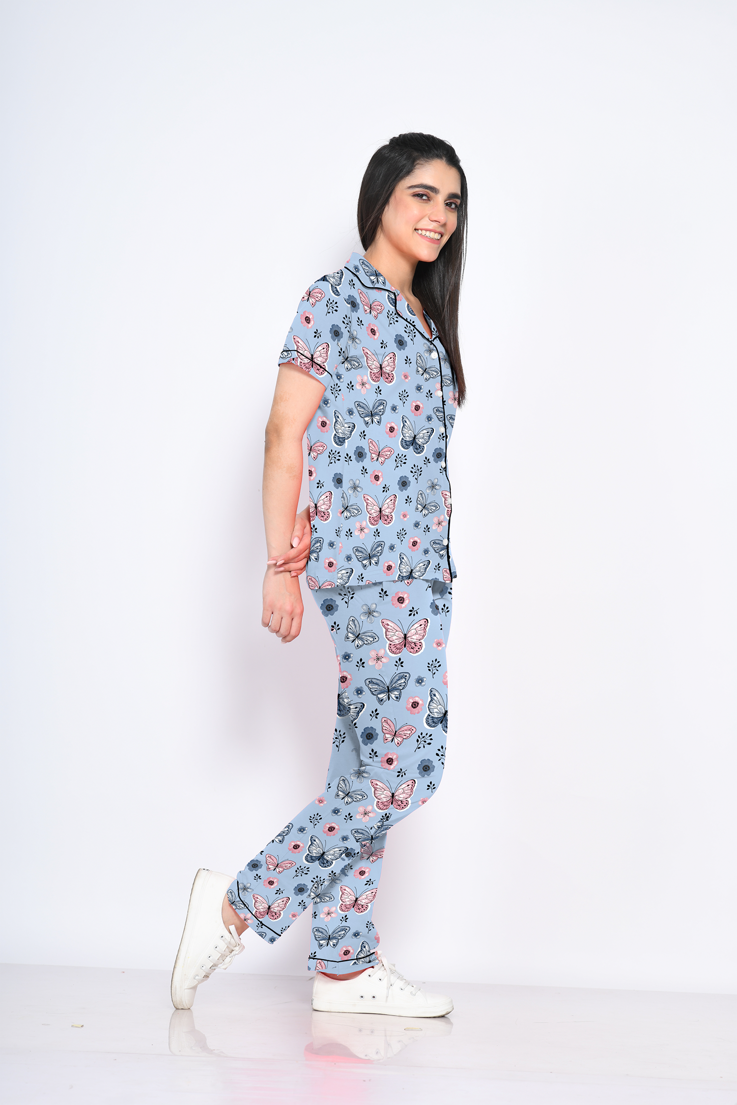 A lady showing side view of Butterfly print nightwear pyjama set by NapStory