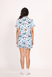 A young lady showing back view of 100% cotton Butterfly print nightwear shorts set for women by Napstory