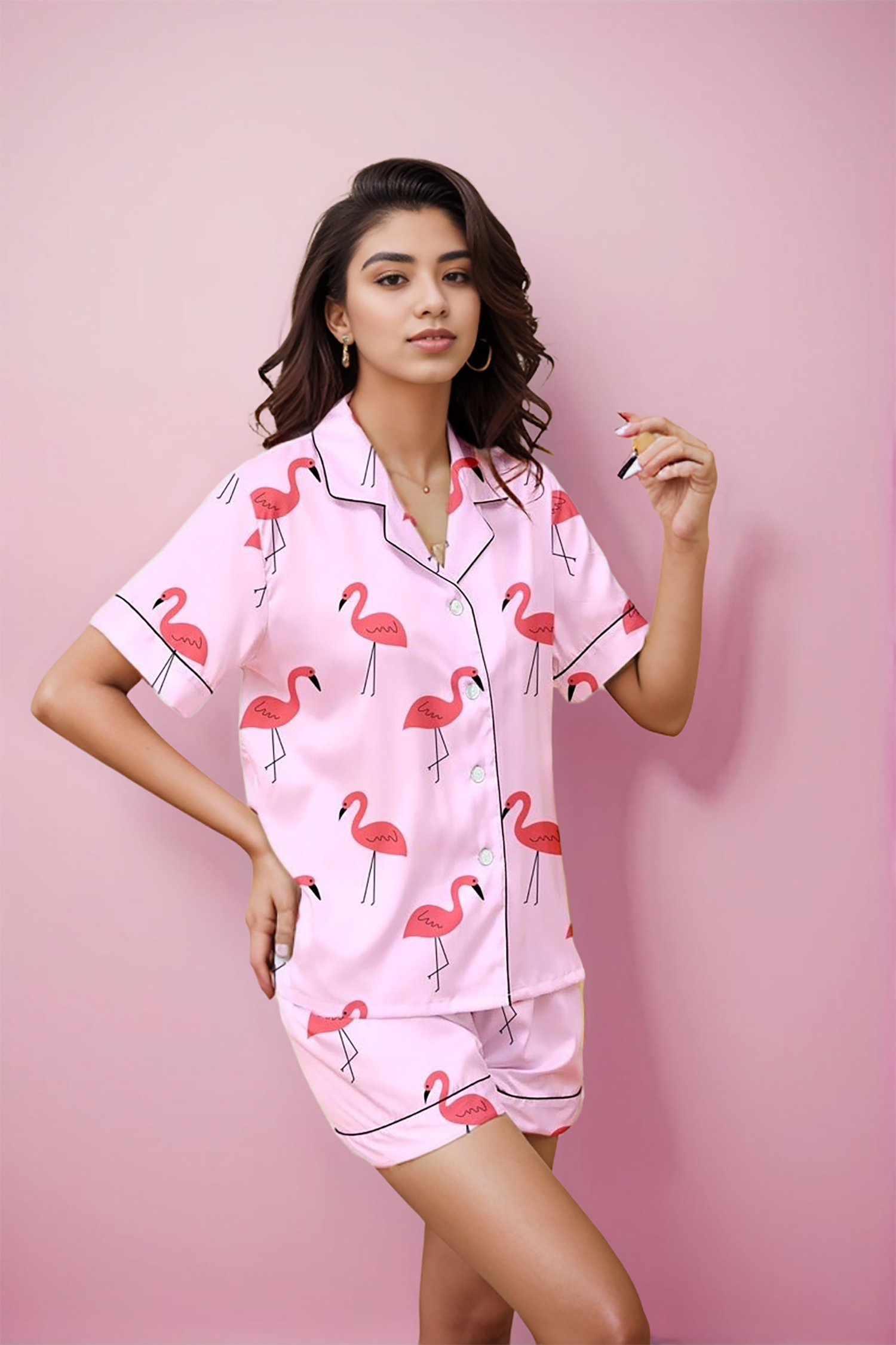 A young lady in Flamingo print shorts set by NapStory