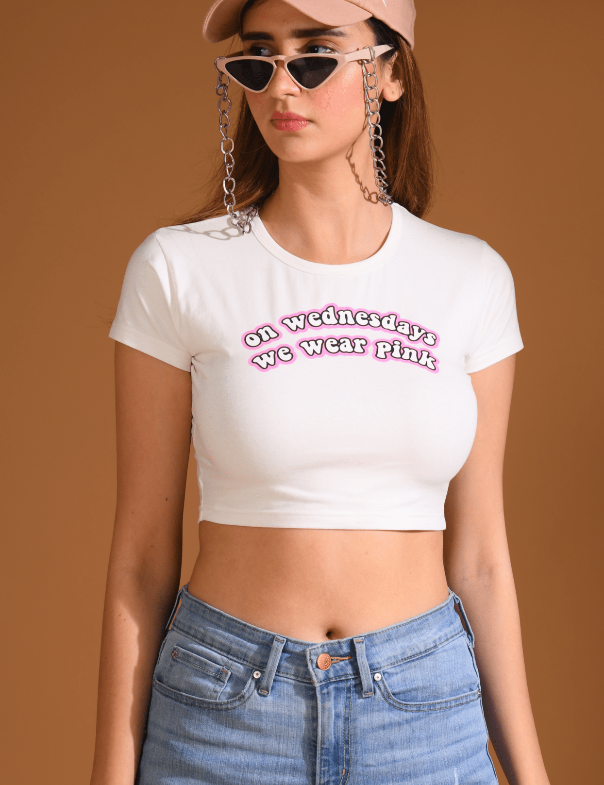 Front view of woman wearing Mean Girls Baby Tee looking at right