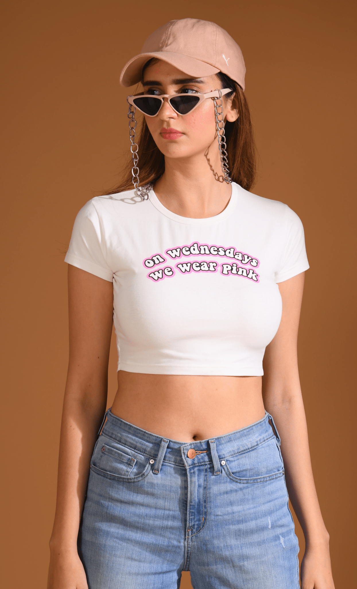 Front view of woman wearing Mean Girls Baby Tee looking at right